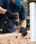 Worker using power drill with clear rigid plastic dust collection tubing set 4 pieces 2.5 in diameter by 36 in length nearby