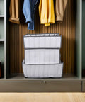 Total Closet Game Changer 3 Pack Seven Grid Foldable Bins With Grippy Handles on a shelf organizing clothes and accessories.