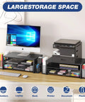 Desk Organizer and Monitor Stand With Drawer and Two Pen Holders for Laptop Setup, Ergonomic Two Tier Riser Elevates Screen for Comfortable Viewing, Space Saving Office Desk Accessory for Clean Clutter Free Boss Level Home Office, Black on desk with office equipment.