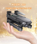 Foldable Camera Drone For Kids Beginners With Remote Control 1080P HD FPV Drone Two Batteries One Key Start And Landing Black shown folded in hand