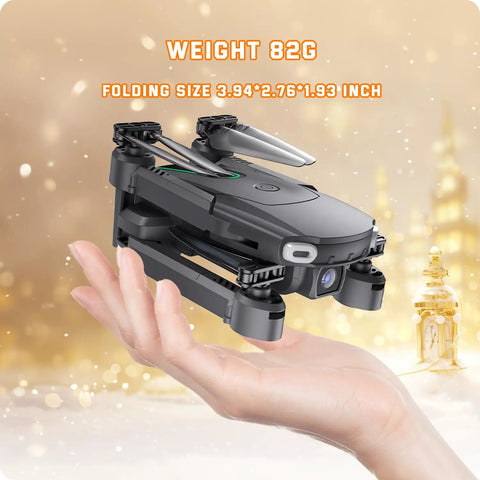 Foldable Camera Drone For Kids Beginners With Remote Control 1080P HD FPV Drone Two Batteries One Key Start And Landing Black shown folded in hand