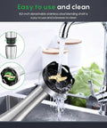 Top Tier Four In One Immersion Hand Blender With Variable Speed Trigger being rinsed under a faucet, showcasing its detachable stainless steel shaft.