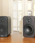 RB42 Reference Bookshelf Speakers With 4 Inch Woofer And Silk Tweeter, Dark Walnut Pair, on wooden desk in living room
