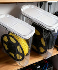 Moisture Proof And Dust Proof 3D Printing Filament Storage Box Set, 4 Pack With Desiccants showing clear box storing filament spools