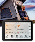 Rugged 8 Inch Off Road GPS Navigator For Off The Grid Adventures displayed in front of a man near a rooftop tent at sunset.