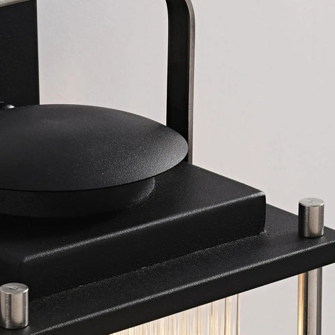 Close-up of Dope Weatherproof Outdoor Wall Light with Striped Glass, black and nickel finish, showing top and screws detail.