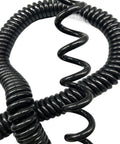 Heavy Duty Coiled Extension Cord With Sweet Spiral Design That Stretches Far And Snaps Right Back For Garage Or Tailgate Use featuring a close-up of the black spiral coils.
