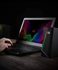 GS520 RGB Desktop Speakers 2.0 Channel PC Computer Stereo System with 6 LED Modes next to laptop on wooden desk