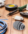 Heavy Duty Flexible Conduit Connectors NPT Three Quarter Inch PVC Pipe Couplers 5 Pack on a wooden surface with tools.