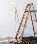 No Sweat Pro Grade Detachable Paint Roller Kit With Telescopic Handle and Three Extra Rods For Quick Diy Wall Painting and Lightweight Portable Home Updates on a ladder.