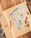 Heavy Duty Hidden Door Pivot Hinges for Wood Doors in 201 Stainless Steel, Concealed Pivot Hinge Kit for Cabinets and Bookshelves on wood board