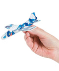 Foam Airplane Glider Toys Set Of 72 Pieces For Parties School Carnivals And Holiday Giveaways Lightweight 5.5 Inch Foam Flyers In Assorted Colors Perfect For Prizes And Party Favors displayed in hand