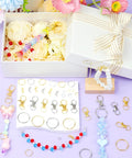 Totally Rad 990 Piece DIY Keychain Craft Kit Featuring Mixed Gold And Silver Assorted Metal Clasps Lobster Hooks And Swivel Snaps For Hella Awesome Charm Jewelry Making And Custom Bag Accessories with assorted hardware and charms.