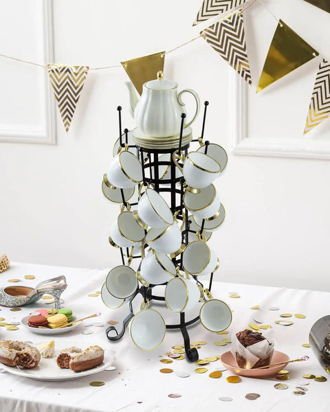 24-Hook Rustic Black Iron Coffee Mug Holder Mug Rack Cup Display Tree with white mugs on decorated table.