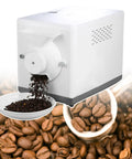 Heavy Duty 1600 Watt Electric Coffee Bean Roaster With Automatic 360 Degree Drum Rotation And Smooth Heat Control pouring roasted beans into a bowl.