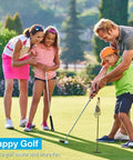 Family enjoying a game of golf on a sunny day, with adults and children learning to putt on the green.