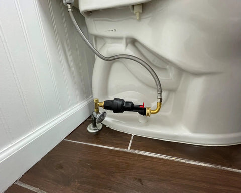 Automatic Toilet Leak Detector And Shutoff Valve Kit That Kicks Pesky Flush Leaks To The Curb And Saves Your Dough From Burst Hose Mayhem Using Hassle Free Installation, installed behind a toilet.