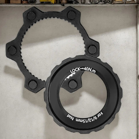 Beefy Center Lock Bike Rotor Tool For Upgrading Your Ride With Durable Aluminum Adapters and Brake Rotors on workshop shelf