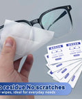 Lens wipes for eyeglasses; white, pre-moistened, individually wrapped; shown with eyeglasses and wipe packets