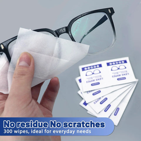 Lens wipes for eyeglasses; white, pre-moistened, individually wrapped; shown with eyeglasses and wipe packets