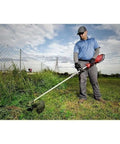 Man using Attachment Extension For M18 FUEL Power Head Quik Lok 3 Ft Reach Fits Hedge Trimmer And Pole Saw Attachments
