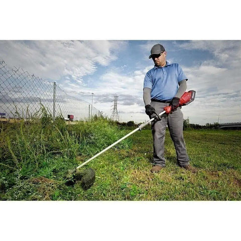Man using Attachment Extension For M18 FUEL Power Head Quik Lok 3 Ft Reach Fits Hedge Trimmer And Pole Saw Attachments