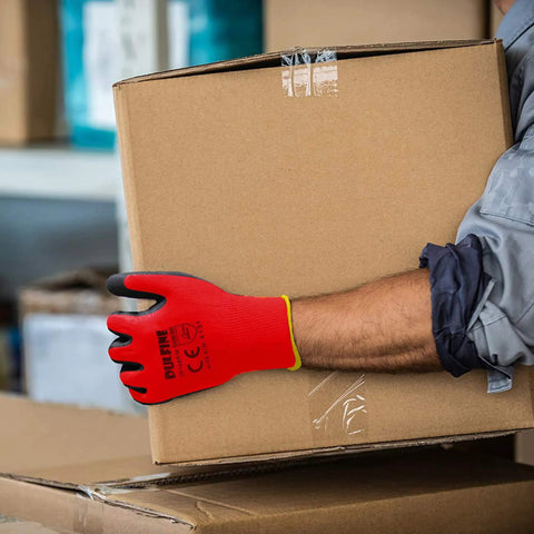 Person wearing PU Coated Work Gloves With Red Seamless Knit Shell 12 Pairs Polyurethane Palm And Finger Grip holding cardboard box