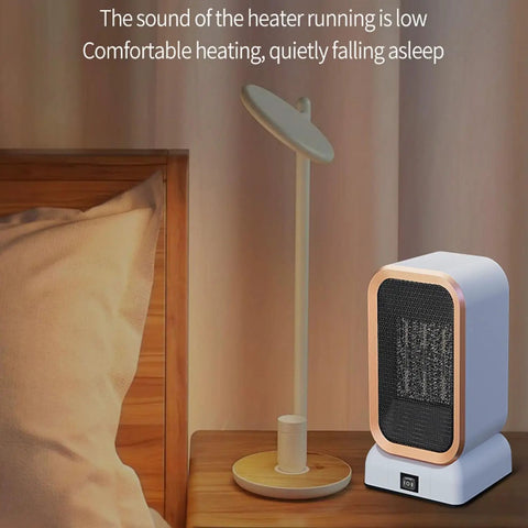Portable Indoor Space Heater 1000 Watts High Output With Two Heat Settings, Compact Desk Heater next to lamp on bedside table