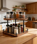 Two Tier Wooden Spice Rack Organizer With 360 Degree Rotating Lazy Susan on kitchen countertop, showcasing spice jars.