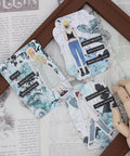 ATC Cards Die Set For Scrapbooking And DIY Card Making displayed with stencils and embellishments on a decorative background.