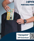 User placing a colorful item into a black backpack next to a portable printer, demonstrating the Wireless Portable Printer Harnesses Bluetooth Thermal Tech For No Sweat Printing Slick Build Slides Easy Into Any Backpack Delivers Serious Cash Wins Running Totally Inkless Making Business Trips A Total Piece Of Cake.