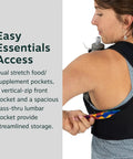 Woman wearing Dyna LT Womens Running Hydration Vest With Hydraulics Soft Flasks, showcasing back pocket storage, Black Medium