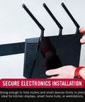 VELCRO Brand Heavy Duty Tape securing a black wireless router with three antennas to the wall