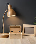 Open wooden box with black iron box folding hinges set, three-fold straight corner design, next to a lamp and frame