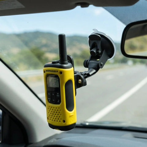 Go-To Suction Cup Car Mount For Two-Way Radios holding a yellow radio on car windshield with flexible arm and quick-lock