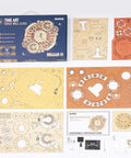 DIY 3D Wooden Puzzle Clock Kit With 168 Pieces, mechanical wooden clock parts and instruction manual laid out