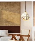 Industrial Marble Pendant Light Fixture Chandeliers in modern living room setting above wooden chair.