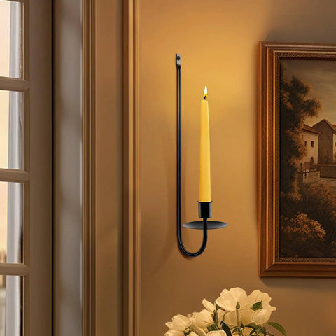Upgrade Your Digs With These Dope Black Metal Wall Candle Sconce Holder Set Of Two Featuring Removable Taper And Pillar Disks For A Chill Cozy Ambiance, black metal wall sconce with a yellow taper candle.