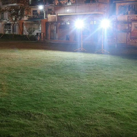 Solid Solar Flood Light With A Kickin Brightness Setup And Zero Sweat Weather Proofing For Your Patio Decks And Yard Upgrades Including Remote Controls And Hella Efficient Led Lighting illuminating a grassy area at night.
