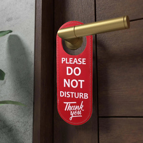 Durable PU Leather Do Not Disturb And Please Knock Door Knob Privacy Sign hanging on door handle, red side visible