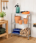 Heavy Duty Three Tier Wire Shelving Rack With Adjustable Chrome Metal Storage Shelves Featuring 750 Lb Capacity Built Like A Tank For Real Garage Workhorse Organization Needs with potted plants.