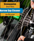Person using gear floss from All In One Bike Cleaning Kit With Chain Degreaser, Chain Scrubber, Chain Lube, Gear Floss, Cleaning Brush Set And Pro Grade Towel For Mountain, Road, Ebike And Trail Bikes on bicycle gears