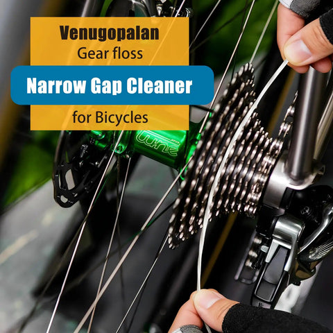 Person using gear floss from All In One Bike Cleaning Kit With Chain Degreaser, Chain Scrubber, Chain Lube, Gear Floss, Cleaning Brush Set And Pro Grade Towel For Mountain, Road, Ebike And Trail Bikes on bicycle gears
