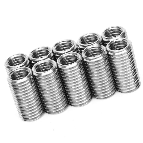 Ten stainless steel thread repair inserts with external threads and inner bore