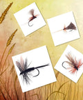10-Piece Black And White Dry Fly Tying Feather Set With Presized Saddle Hackles 6-9 Inches Long Sizes 12 Through 14 displayed