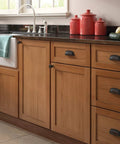 Matte Black Cup Cabinet Pulls 3 Inch Center To Center Handles installed on kitchen cabinets and drawers for farmhouse style