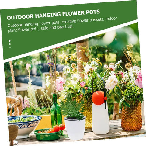 Table decorated with vibrant flowers, outdoor setting. Six Piece Wall Mounted Round Plastic Pothos Planters With Self Watering System For Indoor Balcony Gardens Hydroponic Hanging Flower Pots Set For Home And Office Decor