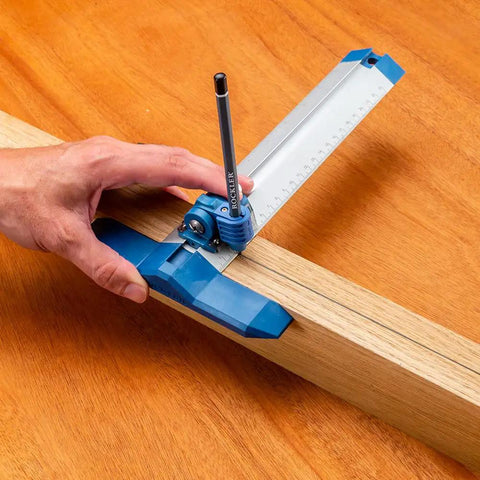 Hand using 9 Inch Quick Draw Marking Gauge For One Hand Operation With Spring Loaded Pencil Carriage And Dovetail Keyway on wood plank.