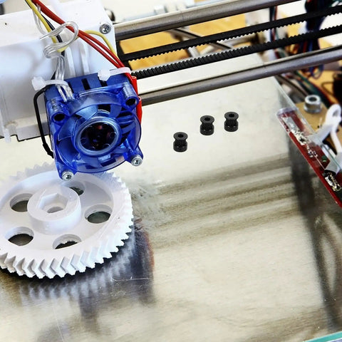 Upgrade Your Build With This Solid Black 5-Piece Timing Belt Pulley Kit For 3D Printers Featuring Durable Aluminum Alloy GT2 Wheels With Bearings And 6mm Width Perfect For Custom DIY Projects. Black GT2 pulleys on 3D printer belt axis