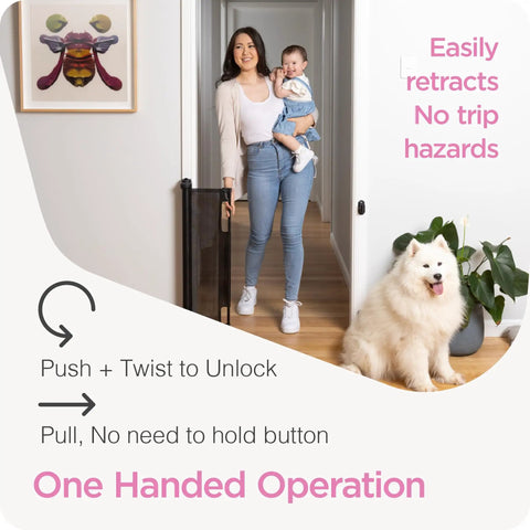 Woman holding baby and dog next to retractable baby gate for stairs and doorways, 33 inch tall by 55 inch wide, mesh safety gate.